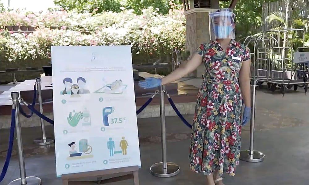 The Bellevue Resort Панглао Екстер'єр фото A woman wearing a face shield at the entrance of a hotel in Paris, France